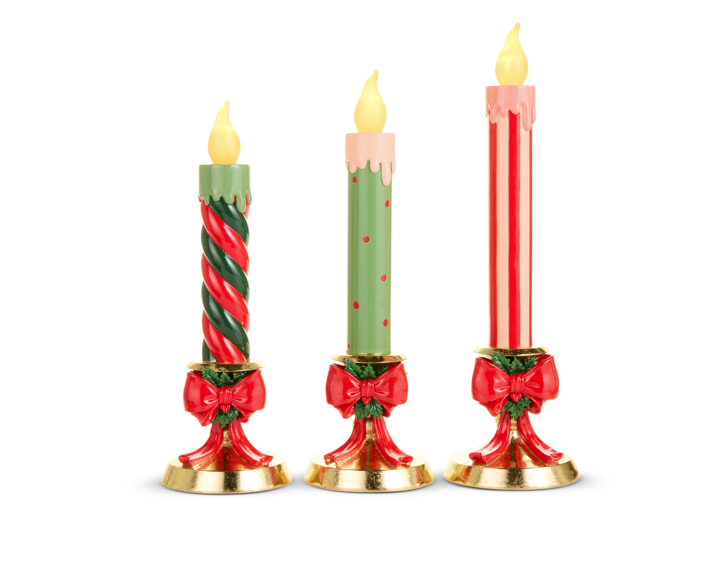 Lighted Candles On Gold Bow Base