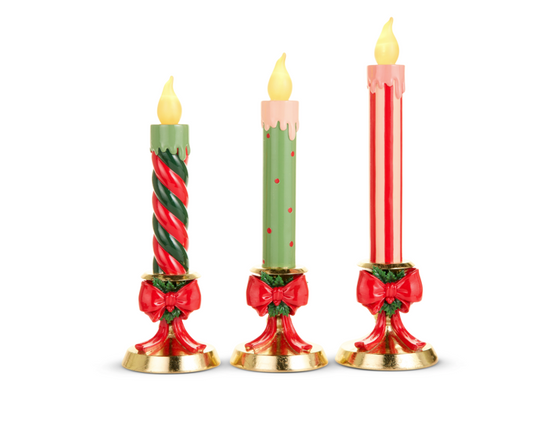 Lighted Candles On Gold Bow Base